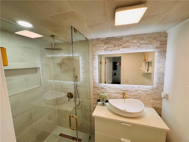 11 Laureldale Dr, Pittsford, NY 14534 - bathroom featuring a stall shower, vanity, decorative backsplash, and ornamental molding