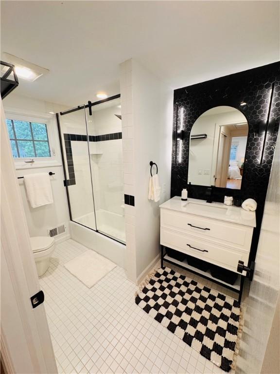 11 Laureldale Dr, Pittsford, NY 14534 - full bathroom featuring tile patterned flooring, vanity, toilet, and baseboards