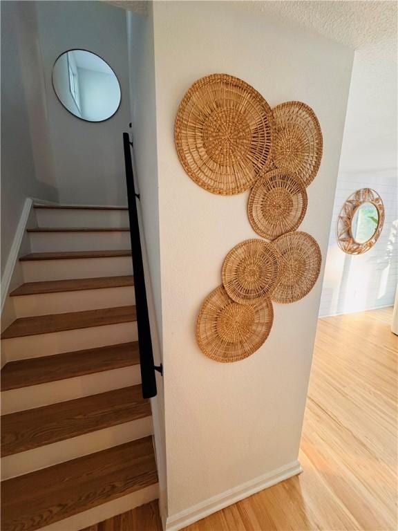 11 Laureldale Dr, Pittsford, NY 14534 - staircase with wood finished floors and baseboards