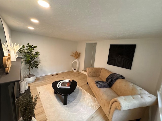 11 Laureldale Dr, Pittsford, NY 14534 - living room with wood finished floors, recessed lighting, and baseboards