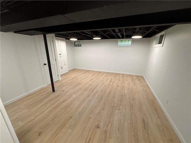 11 Laureldale Dr, Pittsford, NY 14534 - below grade area featuring light wood-style floors and baseboards