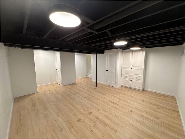 11 Laureldale Dr, Pittsford, NY 14534 - finished basement featuring light wood-style floors, stairs, and baseboards