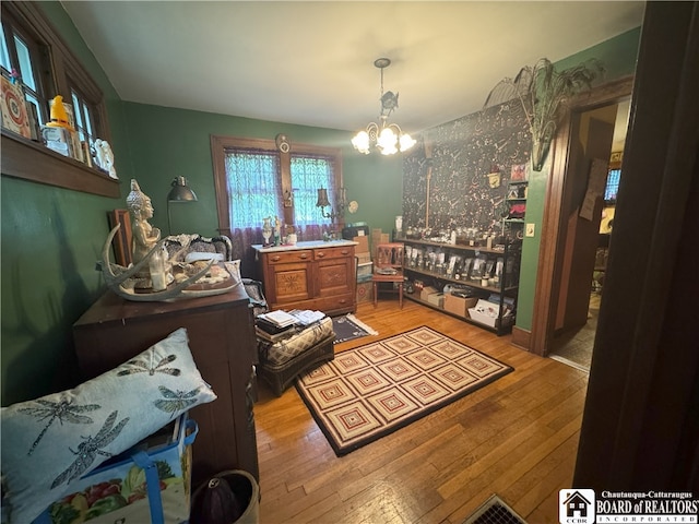 162 Sturges St, Jamestown, NY 14701 - living area featuring light wood finished floors and a chandelier