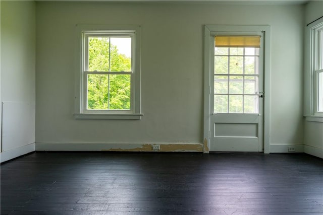 1516 Lake Rd, Webster, NY 14580 - empty room with dark wood-style floors, healthy amount of natural light, and baseboards