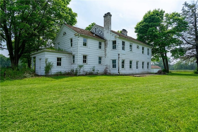 1516 Lake Rd, Webster, NY 14580 - back of property featuring a chimney and a lawn