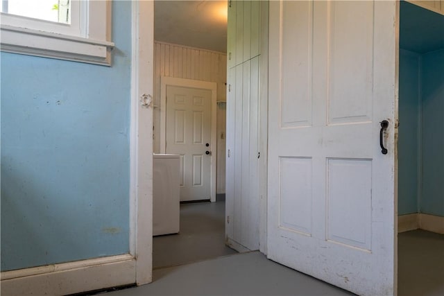 1516 Lake Rd, Webster, NY 14580 - corridor with washer / clothes dryer and finished concrete floors