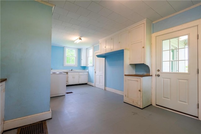 1516 Lake Rd, Webster, NY 14580 - kitchen with white cabinetry, range, a sink, and light floors