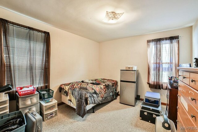 102 Wellworth Pl, Cheektowaga, NY 14225 - carpeted bedroom featuring freestanding refrigerator