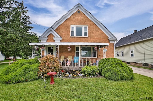 102 Wellworth Pl, Cheektowaga, NY 14225 - view of front facade with brick siding, a porch, and a front yard