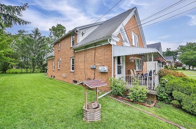 102 Wellworth Pl, Cheektowaga, NY 14225 - view of side of property with brick siding, a lawn, and a porch