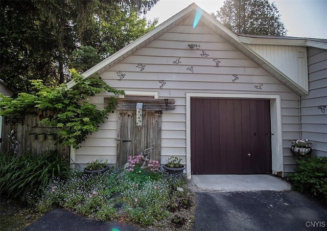 1615 Cortland St, Deruyter, NY 13052 - garage with asphalt driveway