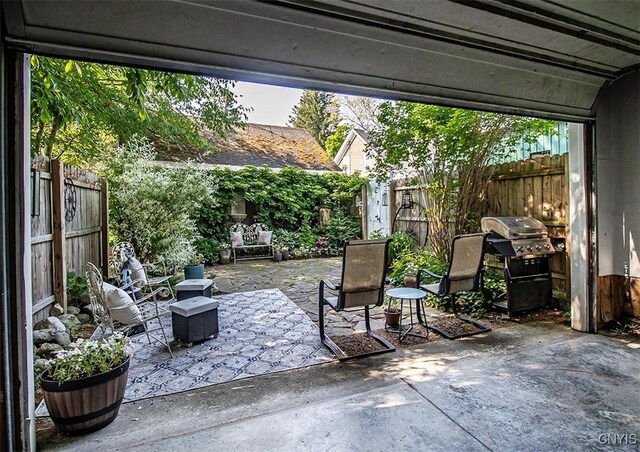 1615 Cortland St, Deruyter, NY 13052 - fenced backyard with a patio and a grill