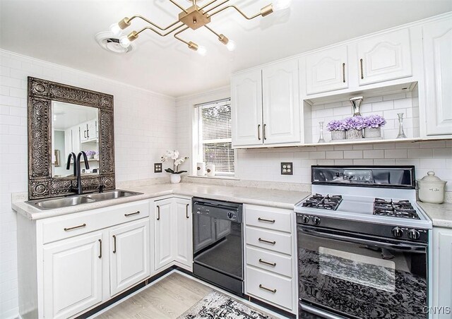 1615 Cortland St, Deruyter, NY 13052 - kitchen with range with gas stovetop, black dishwasher, a sink, crown molding, and decorative backsplash