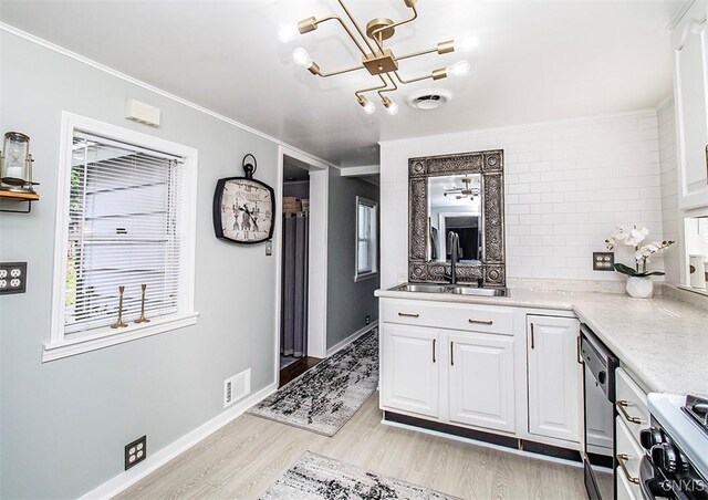 1615 Cortland St, Deruyter, NY 13052 - kitchen featuring a chandelier, light wood finished floors, white cabinets, light countertops, and crown molding