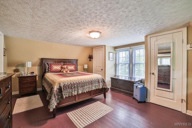 117 Stutzman Rd, Lancaster, NY 14026 - bedroom with dark wood finished floors, baseboards, and a textured ceiling