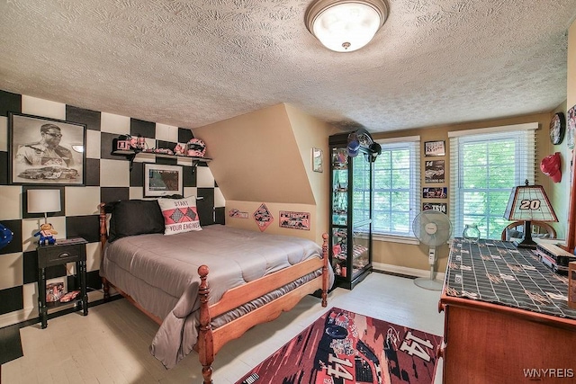 117 Stutzman Rd, Lancaster, NY 14026 - bedroom with a textured ceiling, wood finished floors, and baseboards