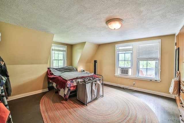 117 Stutzman Rd, Lancaster, NY 14026 - bedroom featuring baseboards, wood finished floors, a textured ceiling, and cooling unit