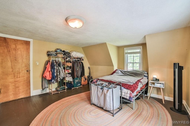 117 Stutzman Rd, Lancaster, NY 14026 - bedroom featuring baseboards, a textured ceiling, and wood finished floors