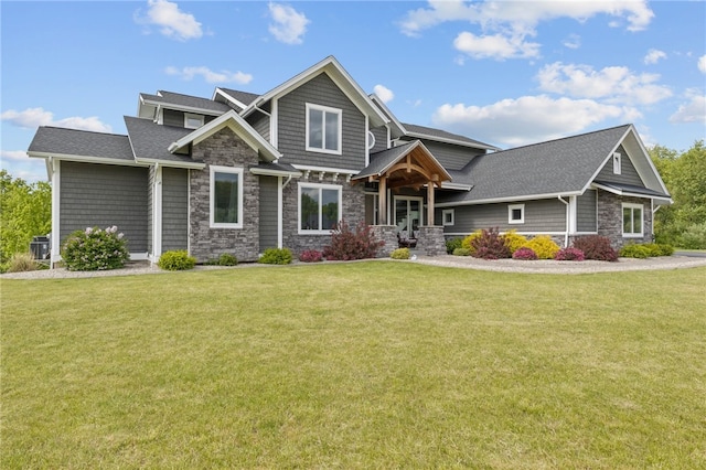 1915 Factors Walk, West Bloomfield, NY 14475 - craftsman-style home featuring stone siding, a front lawn, and a shingled roof