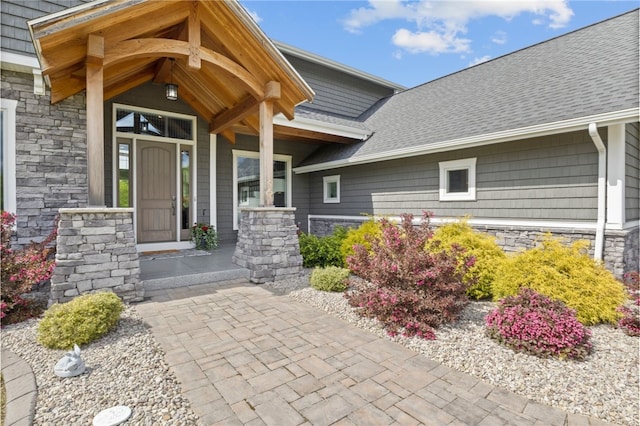 1915 Factors Walk, West Bloomfield, NY 14475 - property entrance featuring stone siding, a porch, and a shingled roof