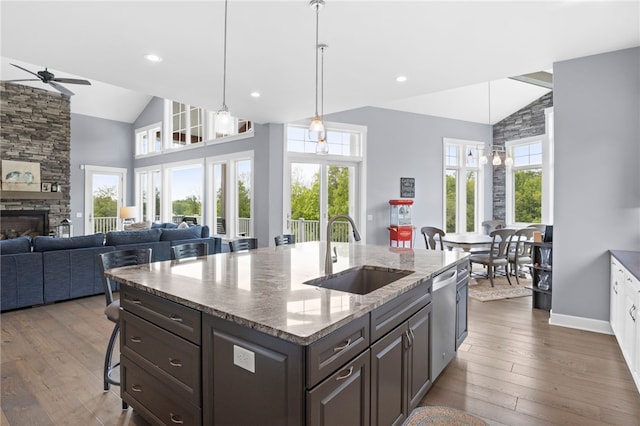 1915 Factors Walk, West Bloomfield, NY 14475 - kitchen with a sink, a ceiling fan, stainless steel dishwasher, hardwood / wood-style flooring, and high vaulted ceiling