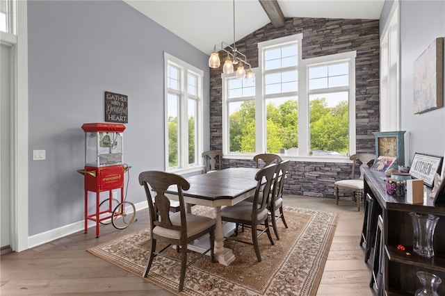 1915 Factors Walk, West Bloomfield, NY 14475 - dining room featuring beamed ceiling, hardwood / wood-style floors, a chandelier, baseboards, and high vaulted ceiling