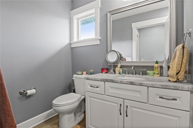 1915 Factors Walk, West Bloomfield, NY 14475 - half bathroom featuring vanity, toilet, and baseboards