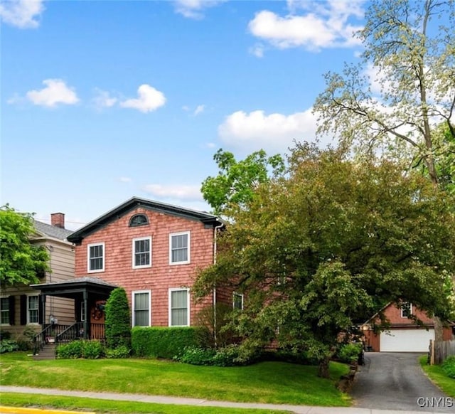 26 Utica St, Kirkland, NY 13323 - view of front of house featuring a front yard, an outdoor structure, and a garage