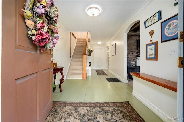 26 Utica St, Kirkland, NY 13323 - foyer featuring arched walkways, stairs, baseboards, and ornamental molding