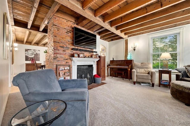 26 Utica St, Kirkland, NY 13323 - living area with wooden ceiling with exposed beams, carpet flooring, and a fireplace with flush hearth