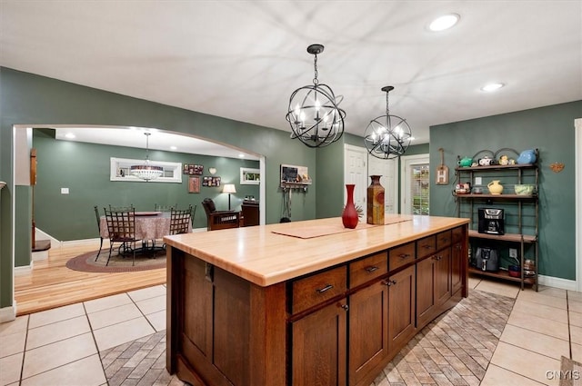 26 Utica St, Kirkland, NY 13323 - kitchen featuring a chandelier, light tile patterned floors, hanging light fixtures, arched walkways, and recessed lighting