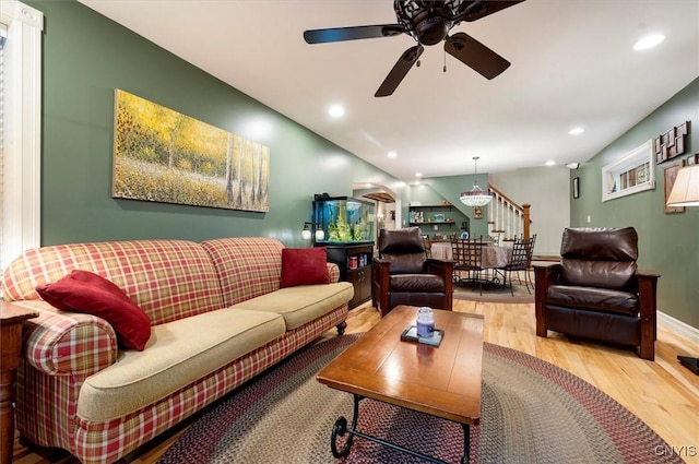 26 Utica St, Kirkland, NY 13323 - living room featuring wood finished floors, ceiling fan, recessed lighting, and stairway