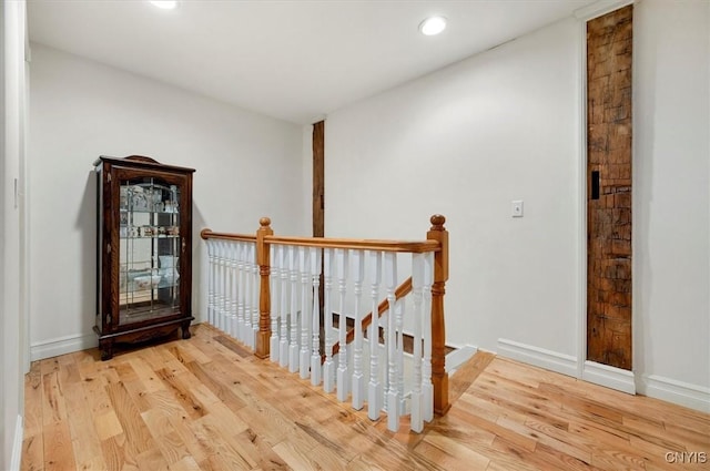 26 Utica St, Kirkland, NY 13323 - hallway with an upstairs landing, wood finished floors, recessed lighting, and baseboards