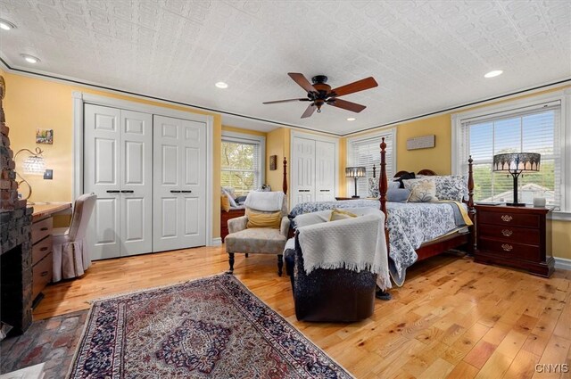 26 Utica St, Kirkland, NY 13323 - bedroom with multiple closets, light wood-type flooring, a ceiling fan, and baseboards