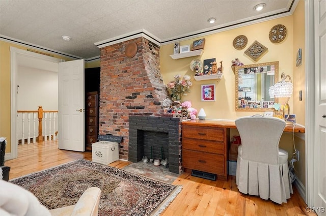 26 Utica St, Kirkland, NY 13323 - office area with wood finished floors, crown molding, a brick fireplace, and recessed lighting