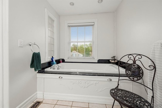 26 Utica St, Kirkland, NY 13323 - bathroom with tile patterned flooring, a garden tub, and baseboards