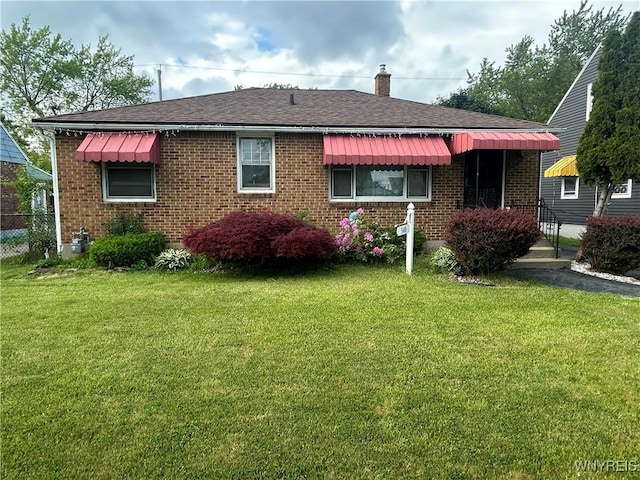 340 Martha Ave, Buffalo, NY 14215 - rear view of property featuring brick siding, a chimney, and roof with shingles