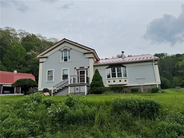 1604 Moland Rd, Alfred, NY 14803 - rear view of house with metal roof