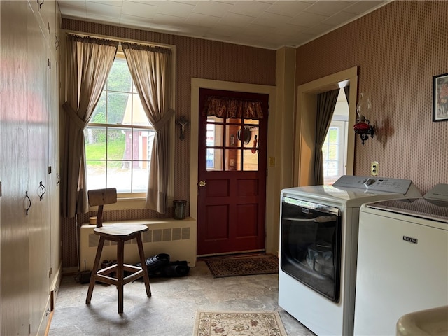 1604 Moland Rd, Alfred, NY 14803 - laundry area with washer and dryer, radiator heating unit, and wallpapered walls