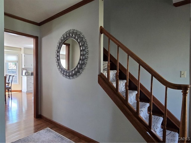 4982 Alfred Dr, Clay, NY 13090 - staircase featuring ornamental molding, wood finished floors, and baseboards