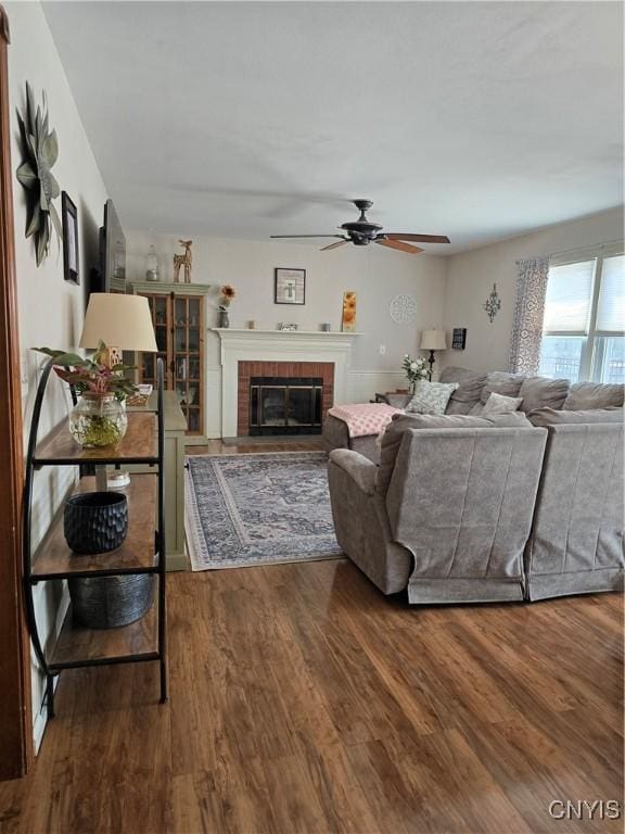 4982 Alfred Dr, Clay, NY 13090 - living room with ceiling fan, wood finished floors, and a brick fireplace