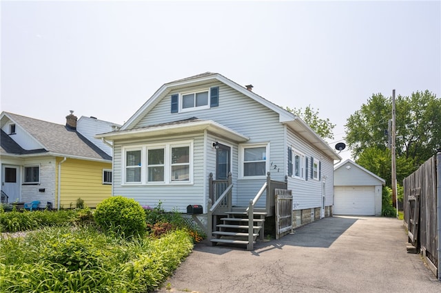 121 Barnard St, Greece, NY 14616 - view of front facade featuring a detached garage and an outdoor structure