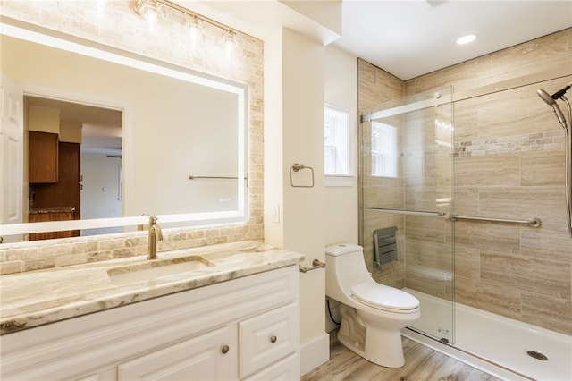 121 Barnard St, Greece, NY 14616 - bathroom featuring vanity, a shower stall, toilet, and wood finished floors