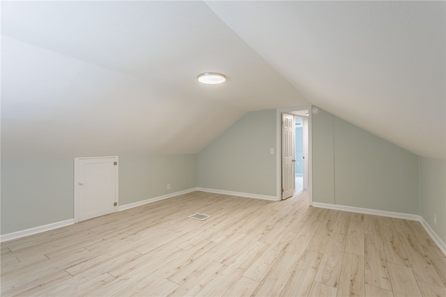 121 Barnard St, Greece, NY 14616 - bonus room with light wood finished floors, vaulted ceiling, and baseboards