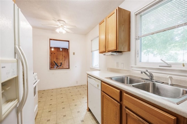 223 S Ave, Parma, NY 14468 - kitchen featuring white appliances, a sink, light floors, and light countertops