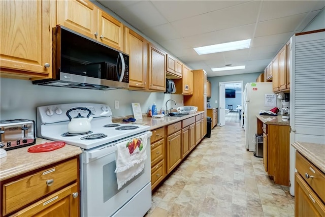 503 Valley Creek Rd, Gates, NY 14624 - kitchen featuring white appliances, a sink, light countertops, and a paneled ceiling