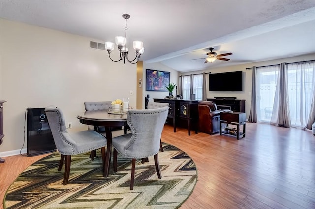 503 Valley Creek Rd, Gates, NY 14624 - dining area with light wood-type flooring, a chandelier, a ceiling fan, and vaulted ceiling