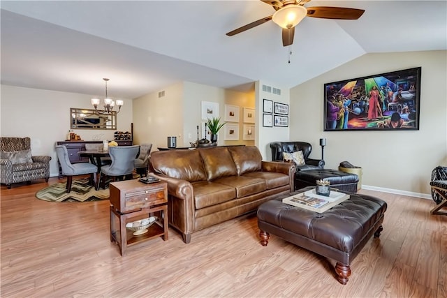 503 Valley Creek Rd, Gates, NY 14624 - living room with a chandelier, a ceiling fan, light wood finished floors, lofted ceiling, and baseboards
