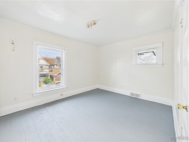 465 10th St, Niagara Falls, NY 14303 - spare room with plenty of natural light, baseboards, crown molding, and wood finished floors