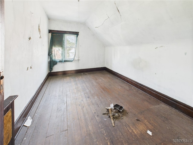 465 10th St, Niagara Falls, NY 14303 - additional living space featuring hardwood / wood-style floors, vaulted ceiling, and baseboards